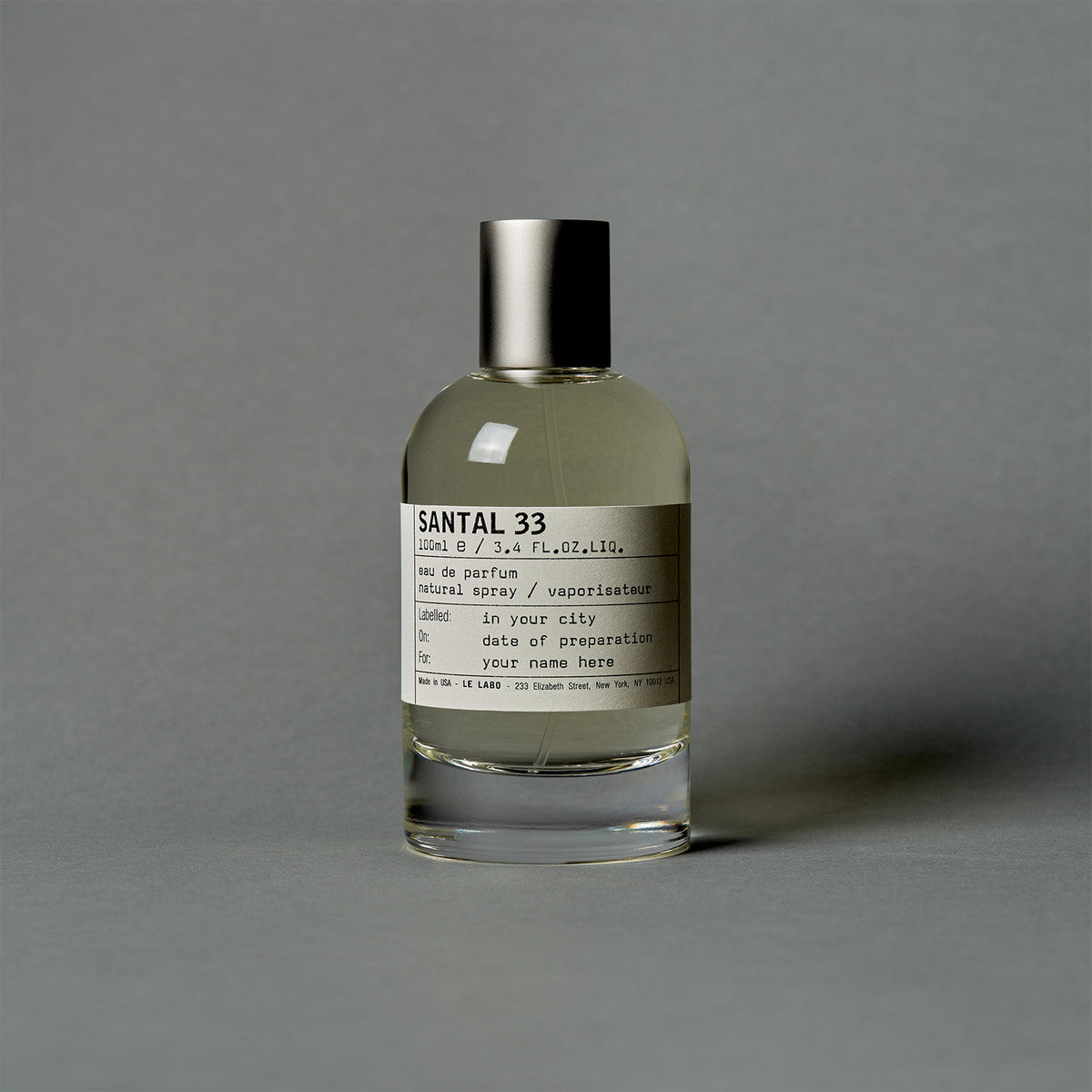 Santal 33 by Le Labo Eau de Parfum 100ml bottle, a unisex woody fragrance with notes of sandalwood, cardamom, iris, and violet for a bold, long-lasting scent.