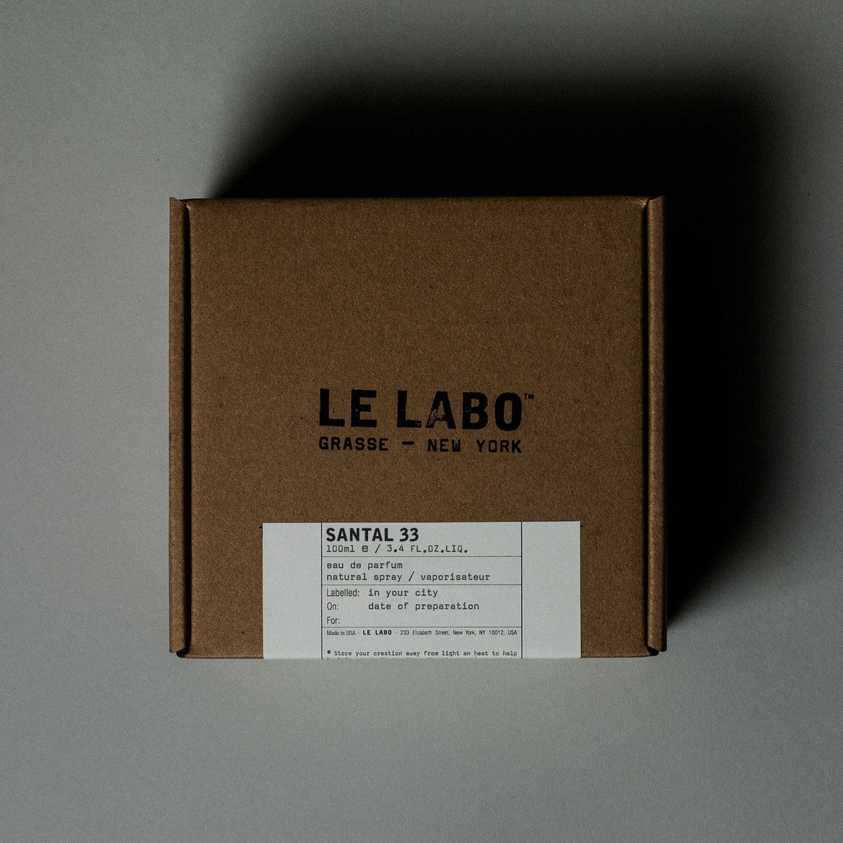 Santal 33 by Le Labo Eau de Parfum 100ml bottle, a unisex woody fragrance with notes of sandalwood, cardamom, iris, and violet for a bold, long-lasting scent.